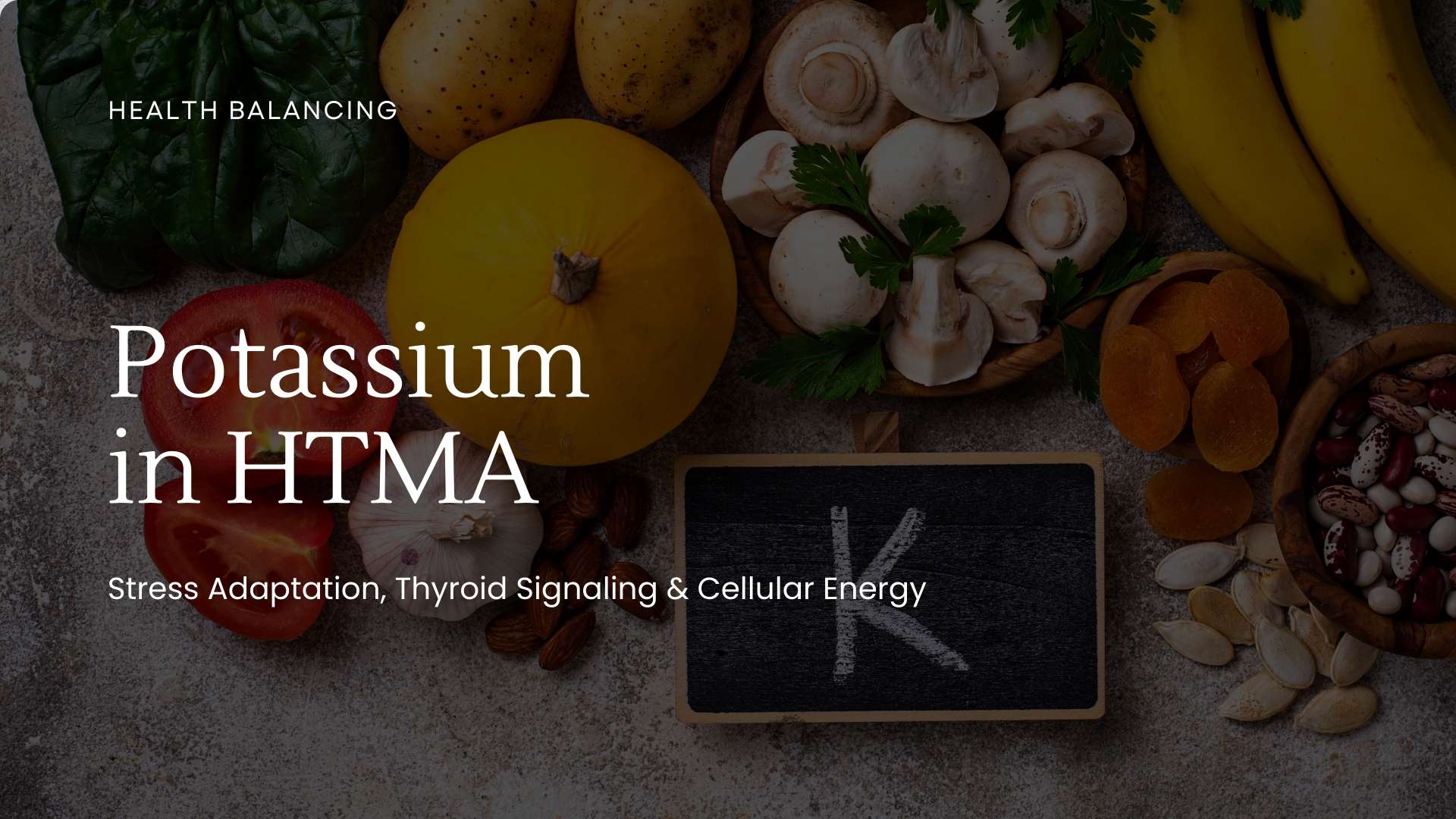 potassium-in-htma-stress-adaptation-thyroid-cellular-energy.jpg "Foods rich in potassium with a chalkboard labeled K, representing potassium in HTMA and its role in stress adaptation, thyroid signaling, and cellular energy."
